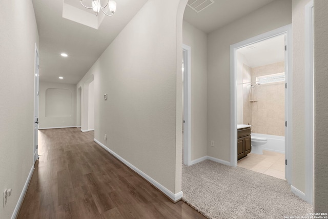 6595 Mason Vly, Schertz, TX 78108 - hallway with arched walkways, recessed lighting, baseboards, and wood finished floors
