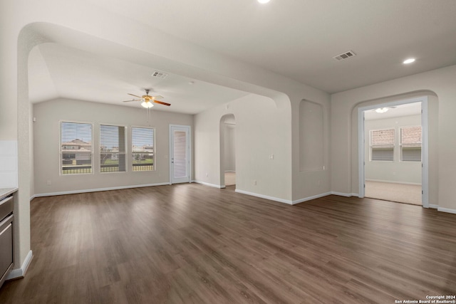 6595 Mason Vly, Schertz, TX 78108 - unfurnished living room featuring ceiling fan, arched walkways, healthy amount of natural light, dark wood-style floors, and recessed lighting