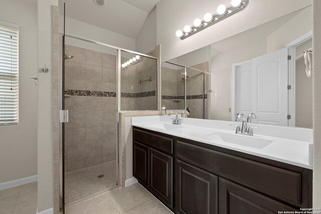 6595 Mason Vly, Schertz, TX 78108 - bathroom featuring a shower stall, double vanity, and tile patterned flooring