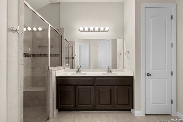 6595 Mason Vly, Schertz, TX 78108 - full bath featuring a stall shower, double vanity, tile patterned flooring, and baseboards