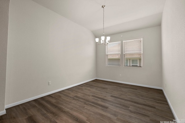 6595 Mason Vly, Schertz, TX 78108 - spare room featuring lofted ceiling, a chandelier, dark wood-style flooring, and baseboards