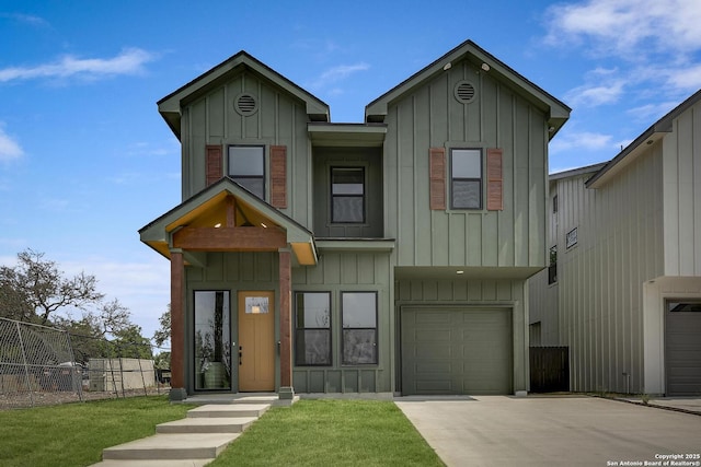 1947 W French Pl, San Antonio, TX 78201 - view of front facade with board and batten siding, concrete driveway, and an attached garage