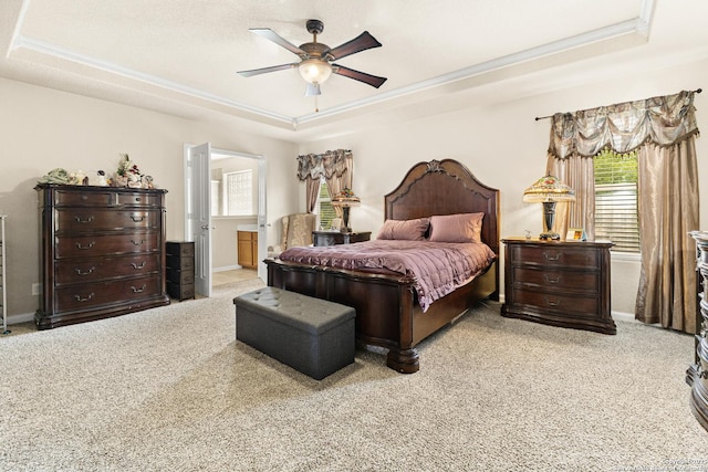 8607 Lahemaa, San Antonio, TX 78251 - carpeted bedroom featuring a tray ceiling, ornamental molding, multiple windows, and baseboards