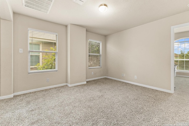 8607 Lahemaa, San Antonio, TX 78251 - unfurnished room featuring carpet, plenty of natural light, and baseboards
