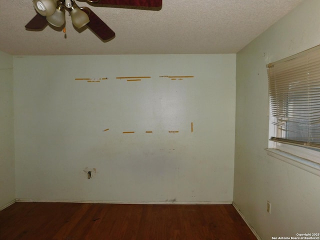 10223 Flatland Trl, Converse, TX 78109 - empty room with a ceiling fan, wood finished floors, a textured ceiling, and baseboards
