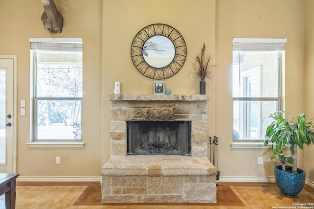 448 Western, Bandera, TX 78003 - detailed view of baseboards and a stone fireplace