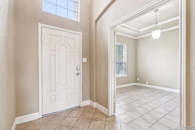 5514 Waldon Walk, San Antonio, TX 78261 - foyer entrance featuring ornamental molding, light tile patterned flooring, baseboards, and a tray ceiling