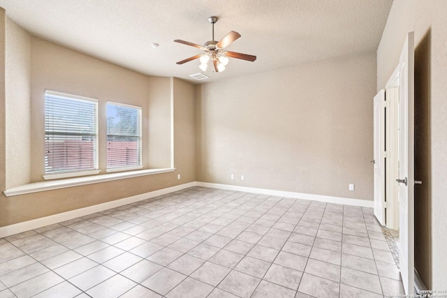 5514 Waldon Walk, San Antonio, TX 78261 - unfurnished room with a ceiling fan, light tile patterned flooring, and a textured ceiling