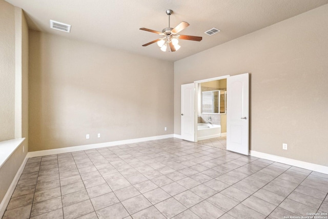 5514 Waldon Walk, San Antonio, TX 78261 - empty room featuring a ceiling fan, light tile patterned flooring, and baseboards
