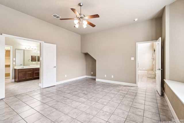 5514 Waldon Walk, San Antonio, TX 78261 - unfurnished bedroom with light tile patterned floors, connected bathroom, and a sink