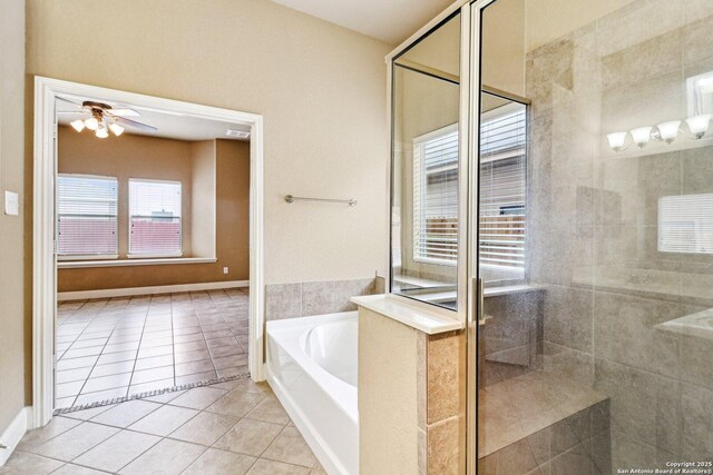 5514 Waldon Walk, San Antonio, TX 78261 - full bathroom with tile patterned floors, a bath, a stall shower, and a ceiling fan
