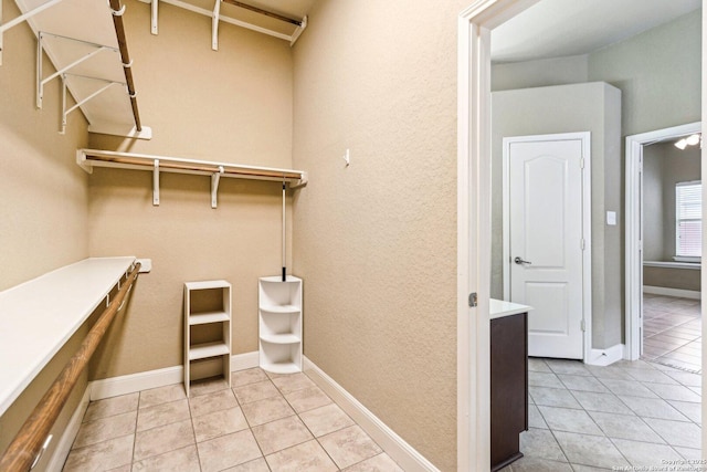 5514 Waldon Walk, San Antonio, TX 78261 - walk in closet with light tile patterned flooring
