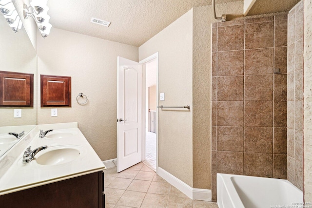 5514 Waldon Walk, San Antonio, TX 78261 - full bath featuring double vanity, tile patterned flooring, baseboards, a textured ceiling, and washtub / shower combination