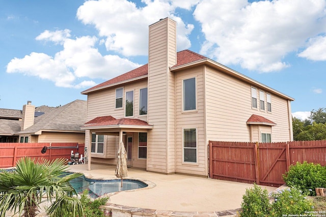 5514 Waldon Walk, San Antonio, TX 78261 - back of property with a patio, a fenced backyard, and a chimney