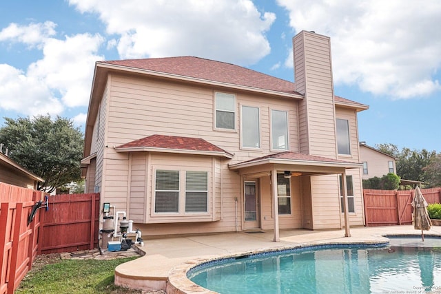 5514 Waldon Walk, San Antonio, TX 78261 - back of house with a patio area, a chimney, a fenced backyard, a ceiling fan, and a shingled roof