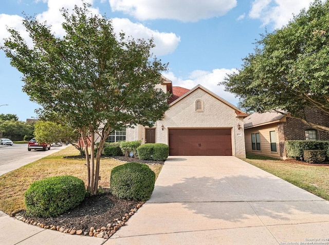 5514 Waldon Walk, San Antonio, TX 78261 - view of front facade featuring brick siding, a garage, concrete driveway, and a front lawn