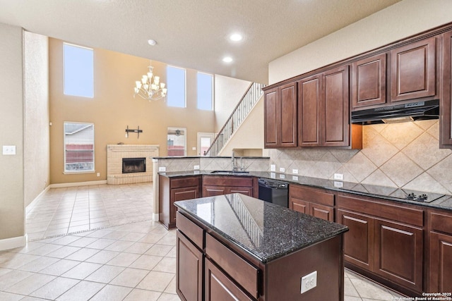 5514 Waldon Walk, San Antonio, TX 78261 - kitchen featuring a sink, under cabinet range hood, black appliances, a chandelier, and backsplash
