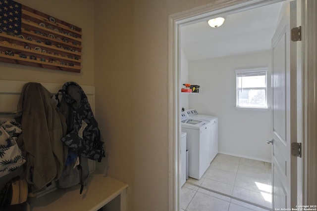 12106 Calm Hbr, San Antonio, TX 78253 - laundry area with washer and dryer and light tile patterned floors