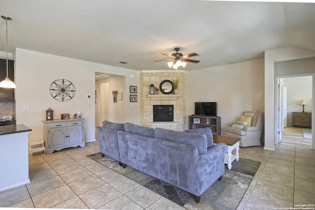 12106 Calm Hbr, San Antonio, TX 78253 - living room with ceiling fan, light tile patterned floors, and a fireplace