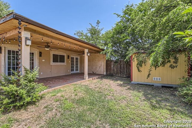 6862 Maple Spgs Unit 6862, San Antonio, TX 78249 - view of yard featuring french doors, ceiling fan, and a patio