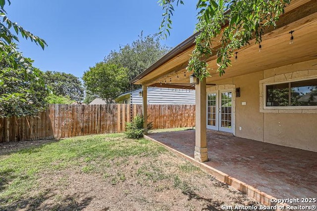 6862 Maple Spgs Unit 6862, San Antonio, TX 78249 - view of yard with french doors and a patio