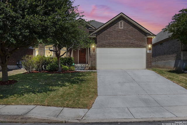 5735 Sweet Desiree, San Antonio, TX 78253 - view of front facade featuring brick siding, a lawn, concrete driveway, and a garage