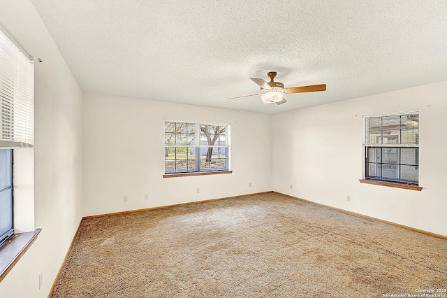 1212 County Road 337, La Vernia, TX 78121 - carpeted spare room with ceiling fan, a textured ceiling, and baseboards
