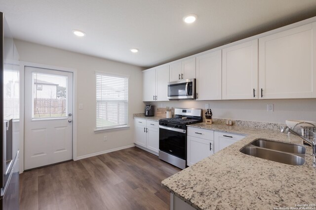 13735 Prospector Post, San Antonio, TX 78253 - kitchen with appliances with stainless steel finishes, a sink, dark wood-style flooring, white cabinets, and recessed lighting