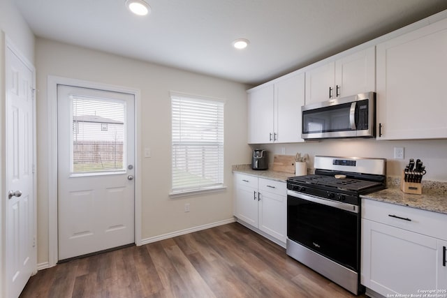 13735 Prospector Post, San Antonio, TX 78253 - kitchen featuring stainless steel appliances, dark wood finished floors, white cabinetry, baseboards, and recessed lighting
