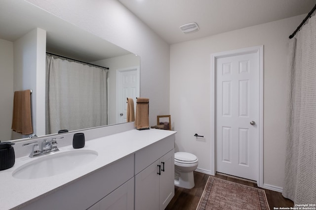 13735 Prospector Post, San Antonio, TX 78253 - bathroom featuring wood finished floors, vanity, and toilet