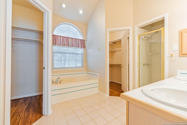 5535 Circle Oak Dr, Bulverde, TX 78163 - full bath with a walk in closet, a bath, a stall shower, double vanity, and tile patterned floors