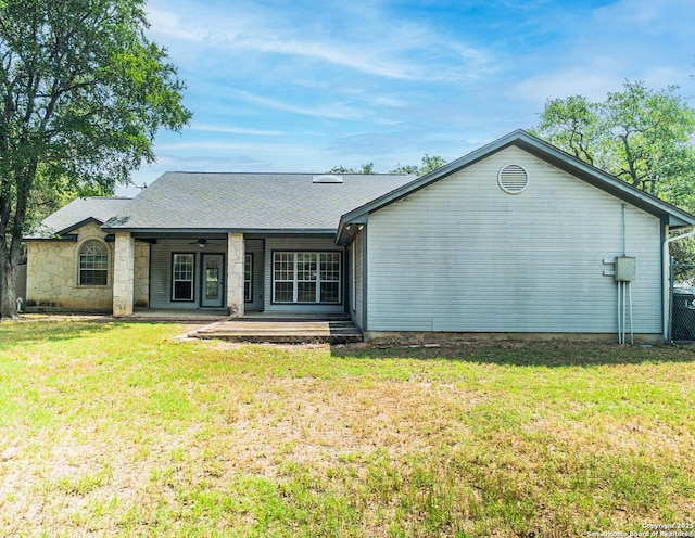 5535 Circle Oak Dr, Bulverde, TX 78163 - back of property featuring a ceiling fan, a lawn, and stone siding