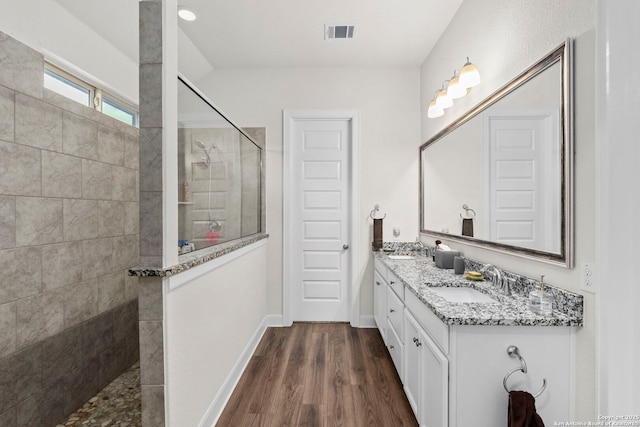 243 Bamberger, New Braunfels, TX 78132 - full bath with walk in shower, double vanity, wood finished floors, and baseboards
