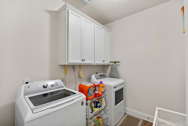 243 Bamberger, New Braunfels, TX 78132 - laundry room featuring washer and dryer, cabinet space, and baseboards