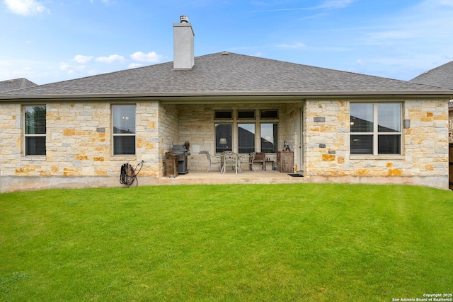 243 Bamberger, New Braunfels, TX 78132 - rear view of property featuring a patio, a yard, a shingled roof, a chimney, and stone siding