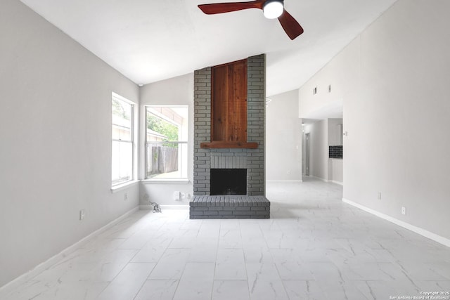 7311 Lansbury Dr, San Antonio, TX 78250 - unfurnished living room featuring lofted ceiling, light marble finish floors, ceiling fan, a fireplace, and baseboards