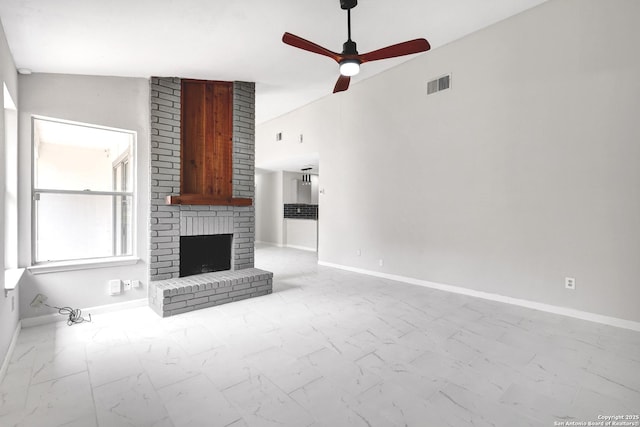 7311 Lansbury Dr, San Antonio, TX 78250 - unfurnished living room with marble finish floors, ceiling fan, a fireplace, and baseboards