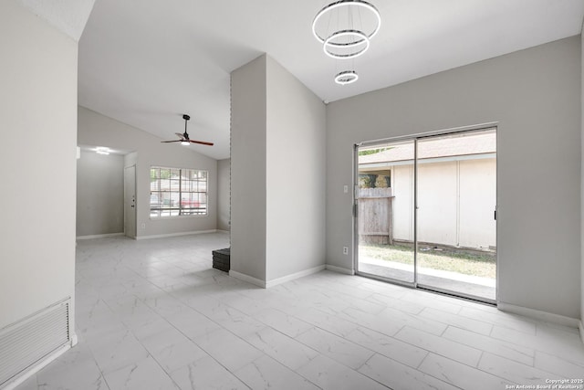 7311 Lansbury Dr, San Antonio, TX 78250 - spare room with marble look tile flooring, ceiling fan, vaulted ceiling, and baseboards