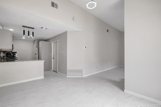 7311 Lansbury Dr, San Antonio, TX 78250 - unfurnished living room with light marble finish flooring and baseboards