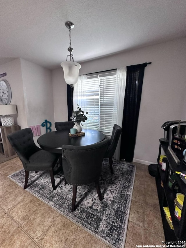 510 Tres Caminos, San Antonio, TX 78245 - dining room featuring a textured ceiling and tile patterned flooring