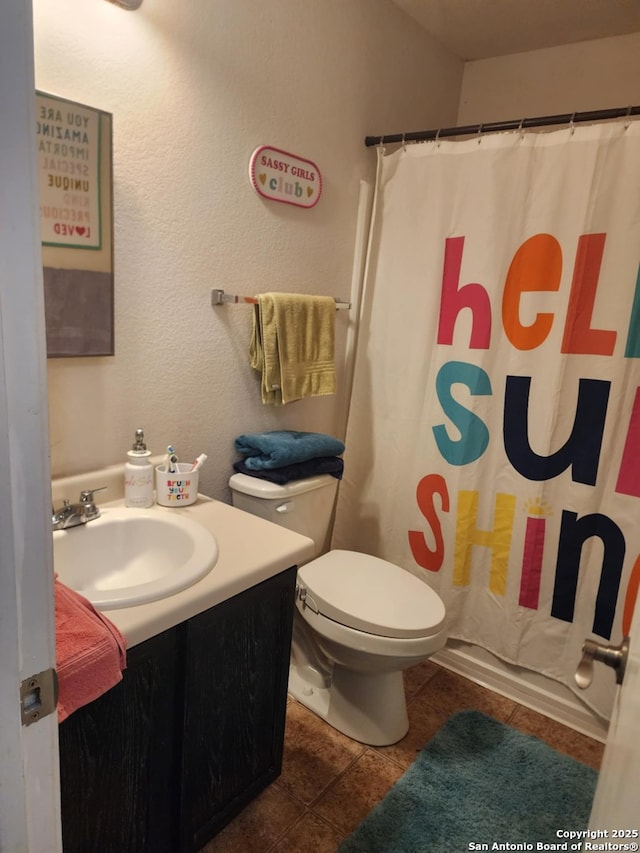 510 Tres Caminos, San Antonio, TX 78245 - bathroom with vanity, toilet, tile patterned flooring, and curtained shower