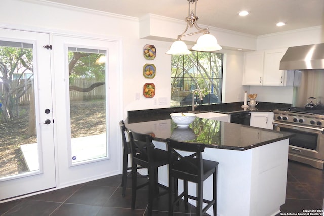 2926 Quail Oak, San Antonio, TX 78232 - kitchen with stainless steel stove, dark tile patterned floors, ornamental molding, white cabinetry, and dishwasher