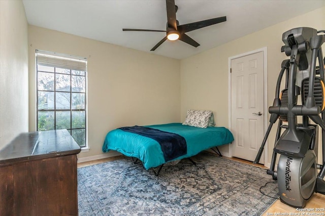 4415 Shavano Way, San Antonio, TX 78249 - bedroom featuring wood finished floors, baseboards, and ceiling fan