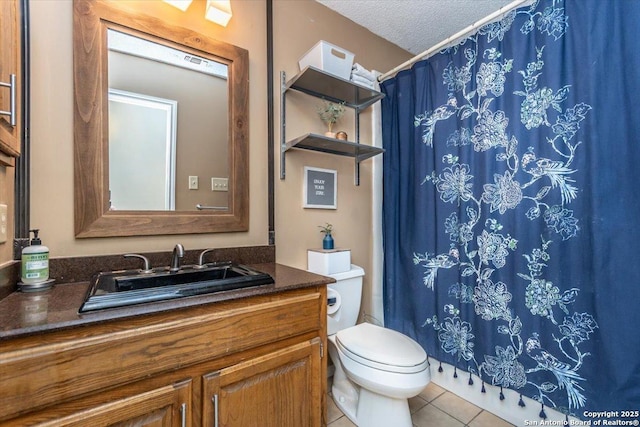 4415 Shavano Way, San Antonio, TX 78249 - bathroom featuring vanity, toilet, a textured ceiling, tile patterned flooring, and a shower with shower curtain