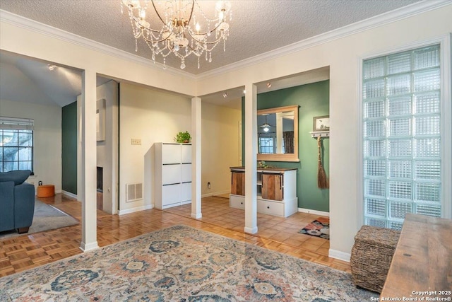 4415 Shavano Way, San Antonio, TX 78249 - entrance foyer featuring a textured ceiling, baseboards, a chandelier, and ornamental molding