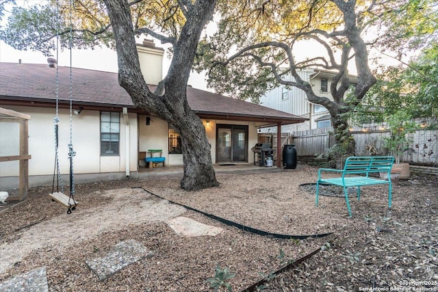 4415 Shavano Way, San Antonio, TX 78249 - rear view of house with stucco siding, a patio area, and a shingled roof