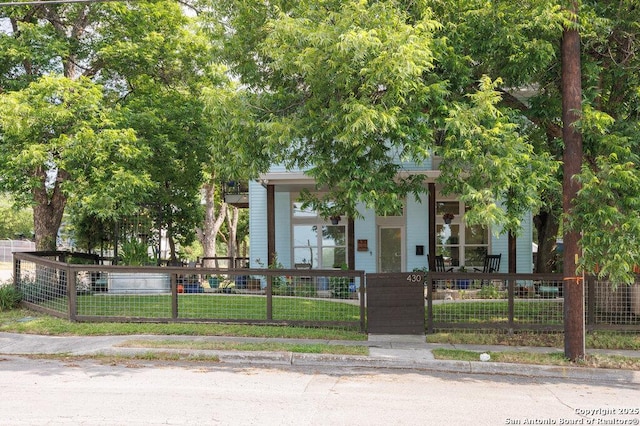 430 Burleson, San Antonio, TX 78202 - view of property hidden behind natural elements with covered porch and a gate