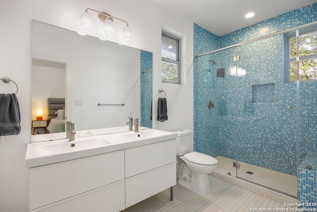 430 Burleson, San Antonio, TX 78202 - bathroom with ensuite bathroom, toilet, double vanity, and a shower stall