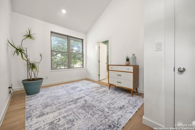 430 Burleson, San Antonio, TX 78202 - bedroom with wood finished floors, baseboards, and high vaulted ceiling
