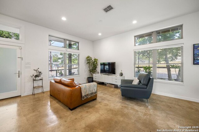 430 Burleson, San Antonio, TX 78202 - living room with finished concrete flooring, baseboards, and recessed lighting